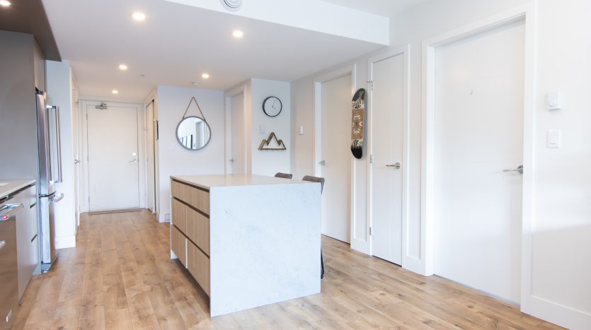 Squamish condo in Jumar with huge terrace featuring unobstructed mountain views and all day sun.